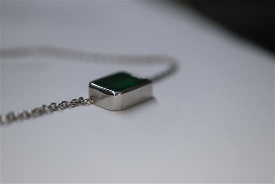 An 18ct white gold and solitaire emerald set pendant necklace, pendant 9mm.